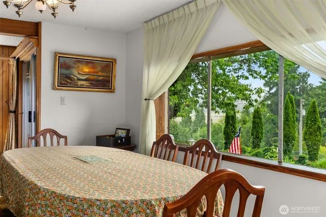 a bedroom with a large bed and a dresser