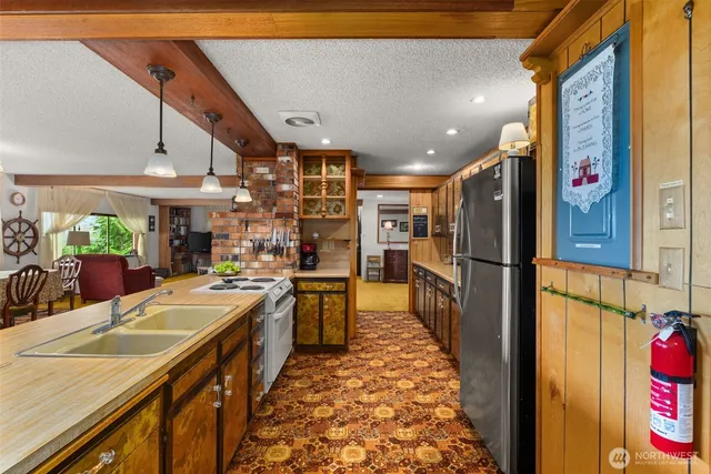 a view of a room with wooden floor and windows