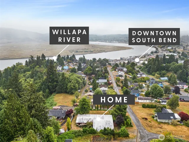 a view of a chairs and table in the backyard