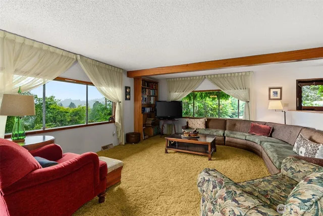a view of a porch with furniture and front door