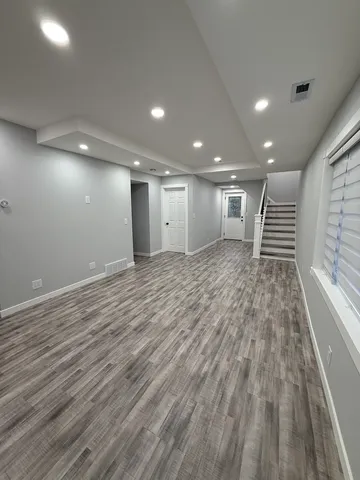a view of entryway with wooden floor