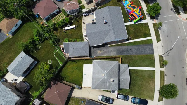 an aerial view of residential houses with outdoor space