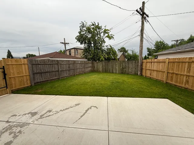 a backyard of a house with lots of green space