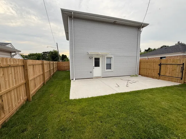 a view of a backyard with flat screen tv