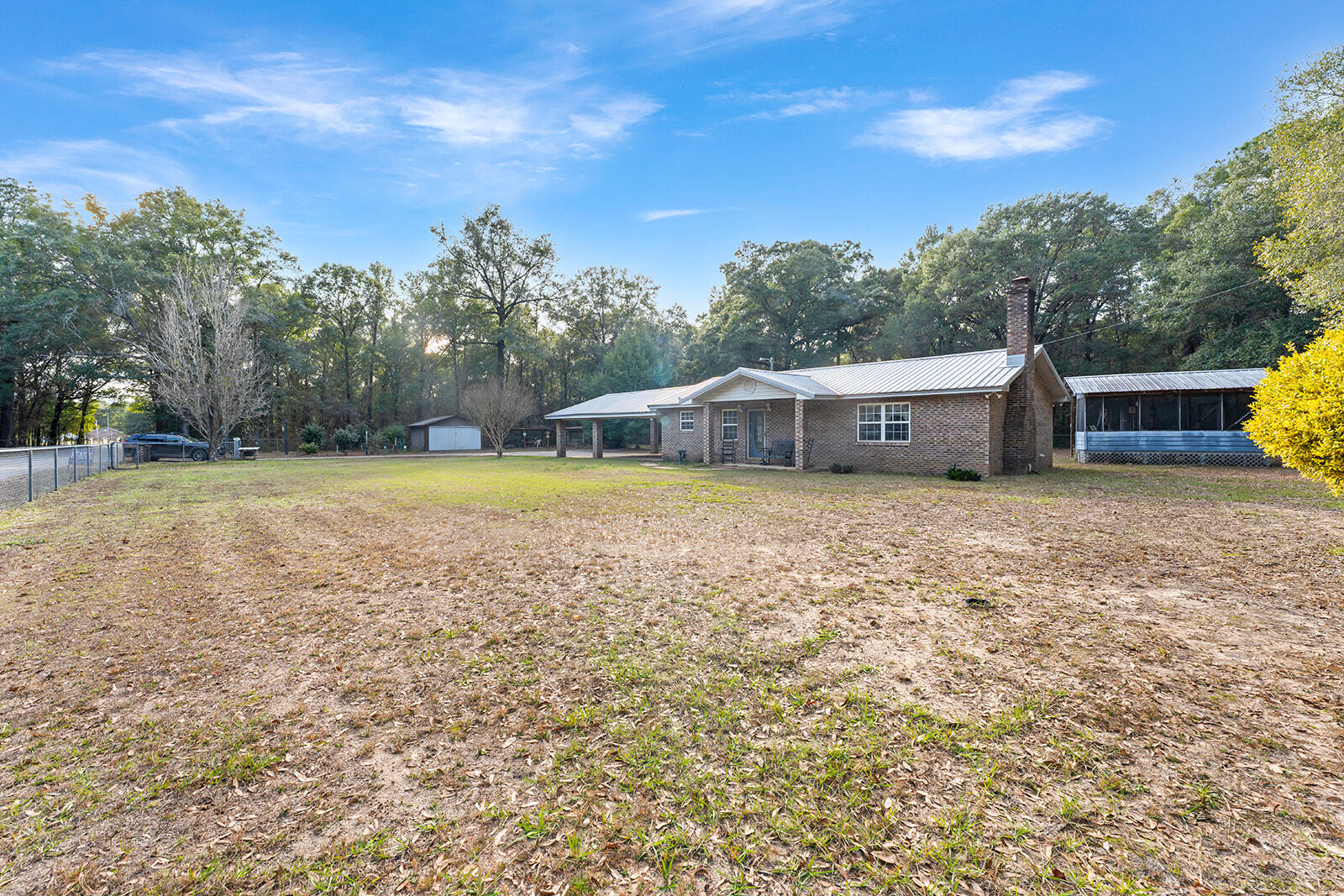 4780 Griffith Road Holt, FL 32564 - Photo 12 of 44 a view of a house with swimming pool and a yard