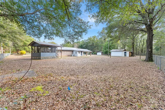 a living room with couches and furniture with wooden floor