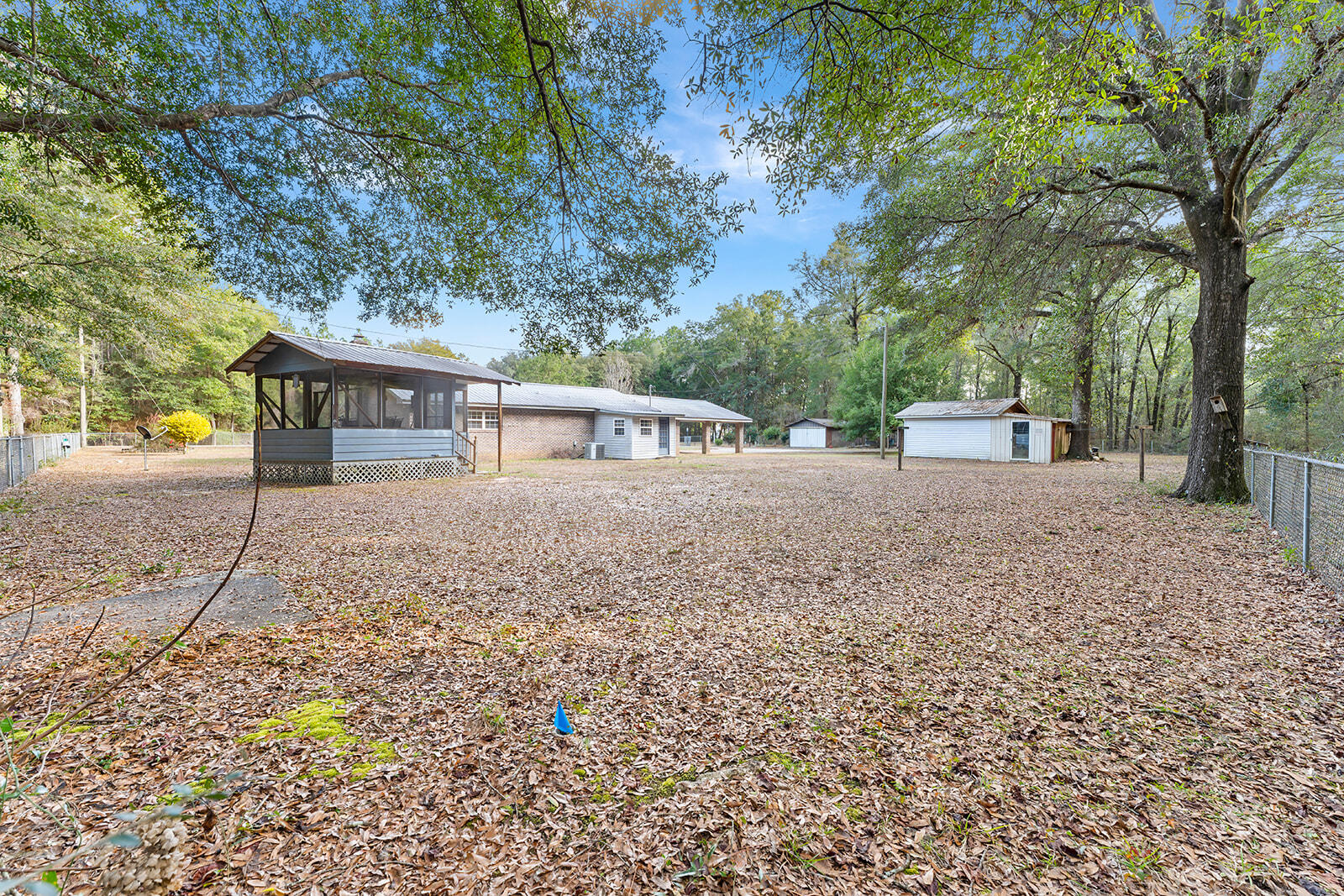4780 Griffith Road Holt, FL 32564 - Photo 13 of 44 a view of a house with a yard