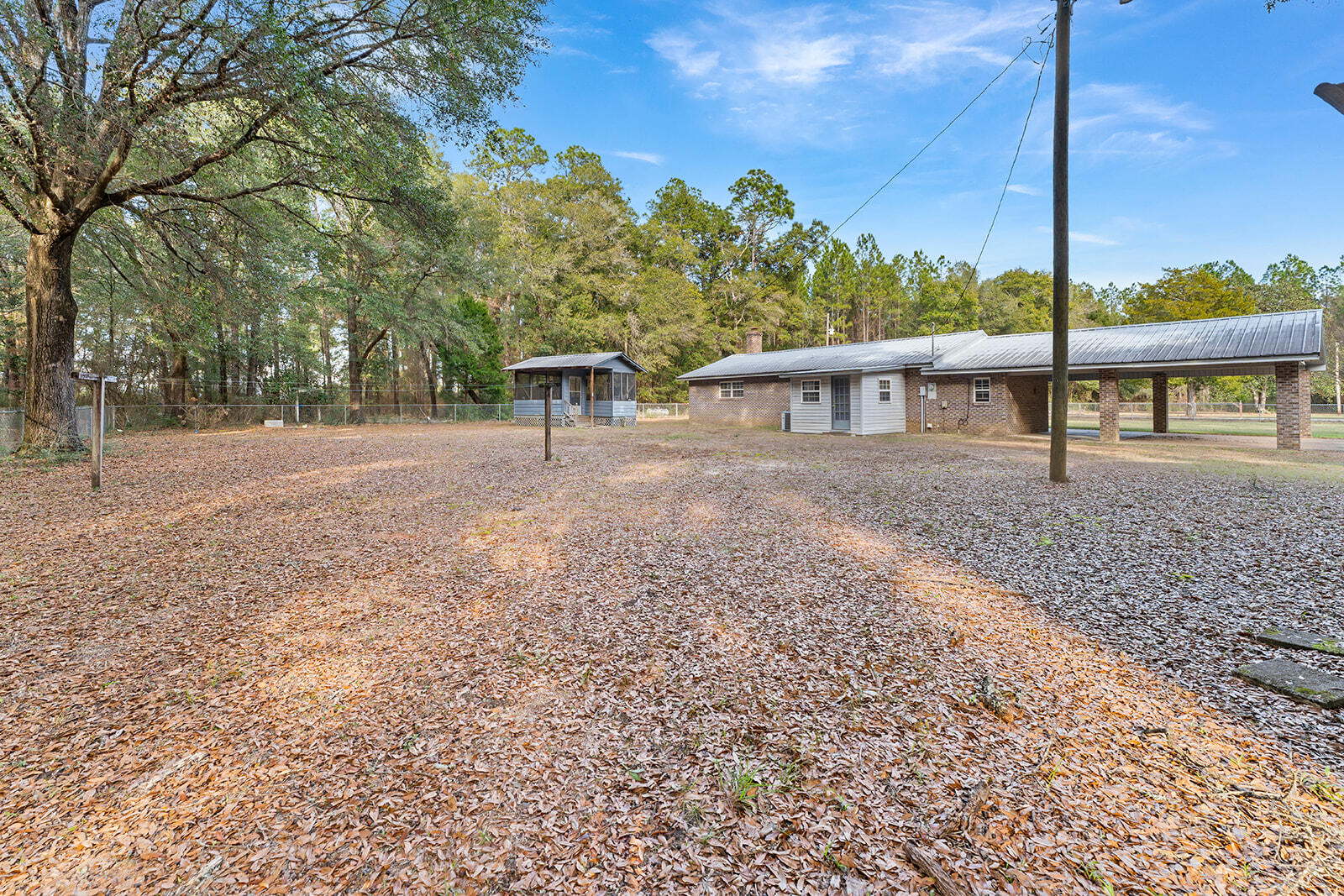 4780 Griffith Road Holt, FL 32564 - Photo 14 of 44 a view of an house with backyard and trees