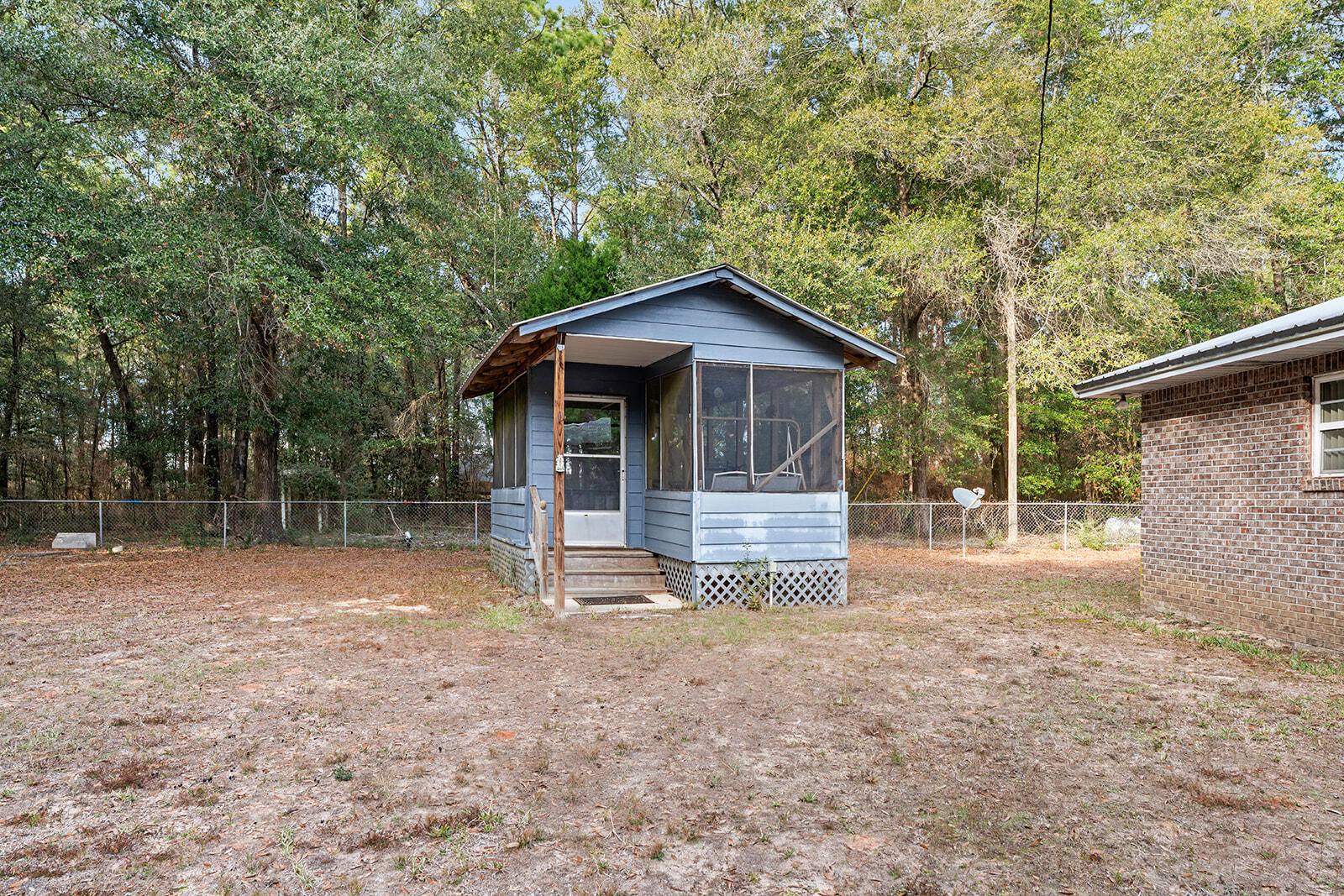 4780 Griffith Road Holt, FL 32564 - Photo 16 of 44 a view of a house with a yard