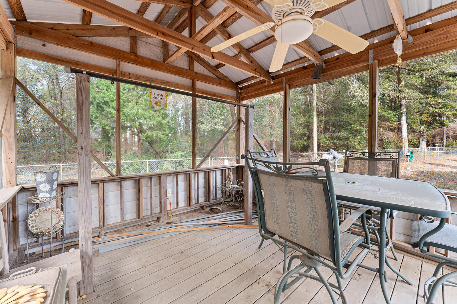 4780 Griffith Road Holt, FL 32564 - Photo 18 of 44 a view of a patio with a table chairs and a glass door