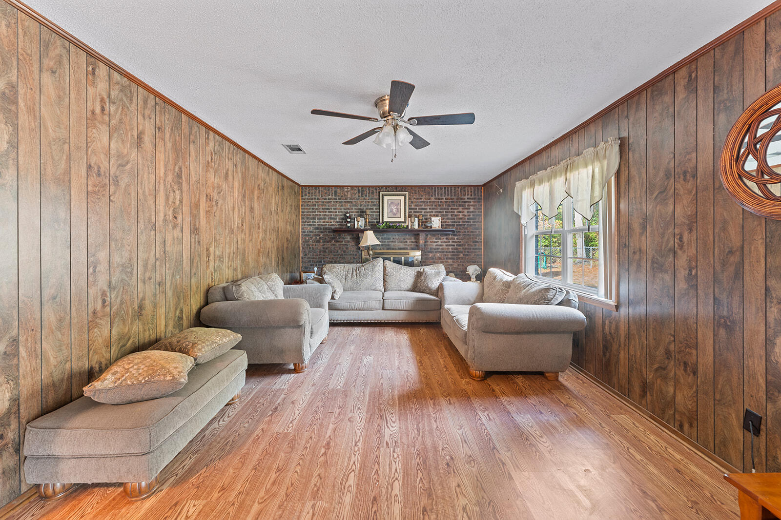 4780 Griffith Road Holt, FL 32564 - Photo 22 of 44 a living room with furniture and a large window