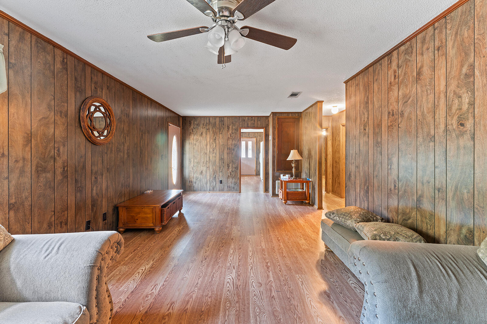 4780 Griffith Road Holt, FL 32564 - Photo 23 of 44 a living room with couches and furniture with wooden floor