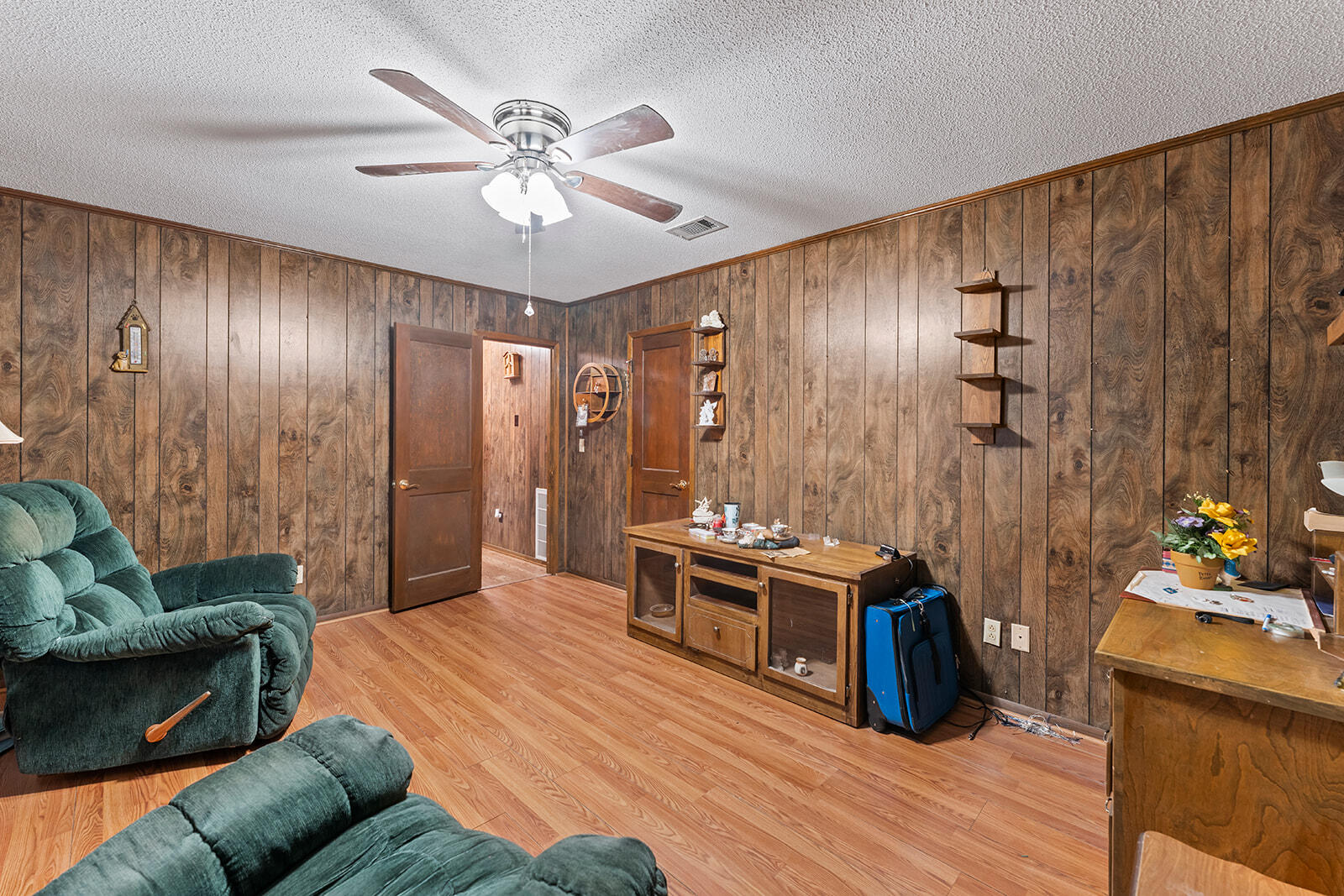 4780 Griffith Road Holt, FL 32564 - Photo 28 of 44 a living room with furniture and wooden floor
