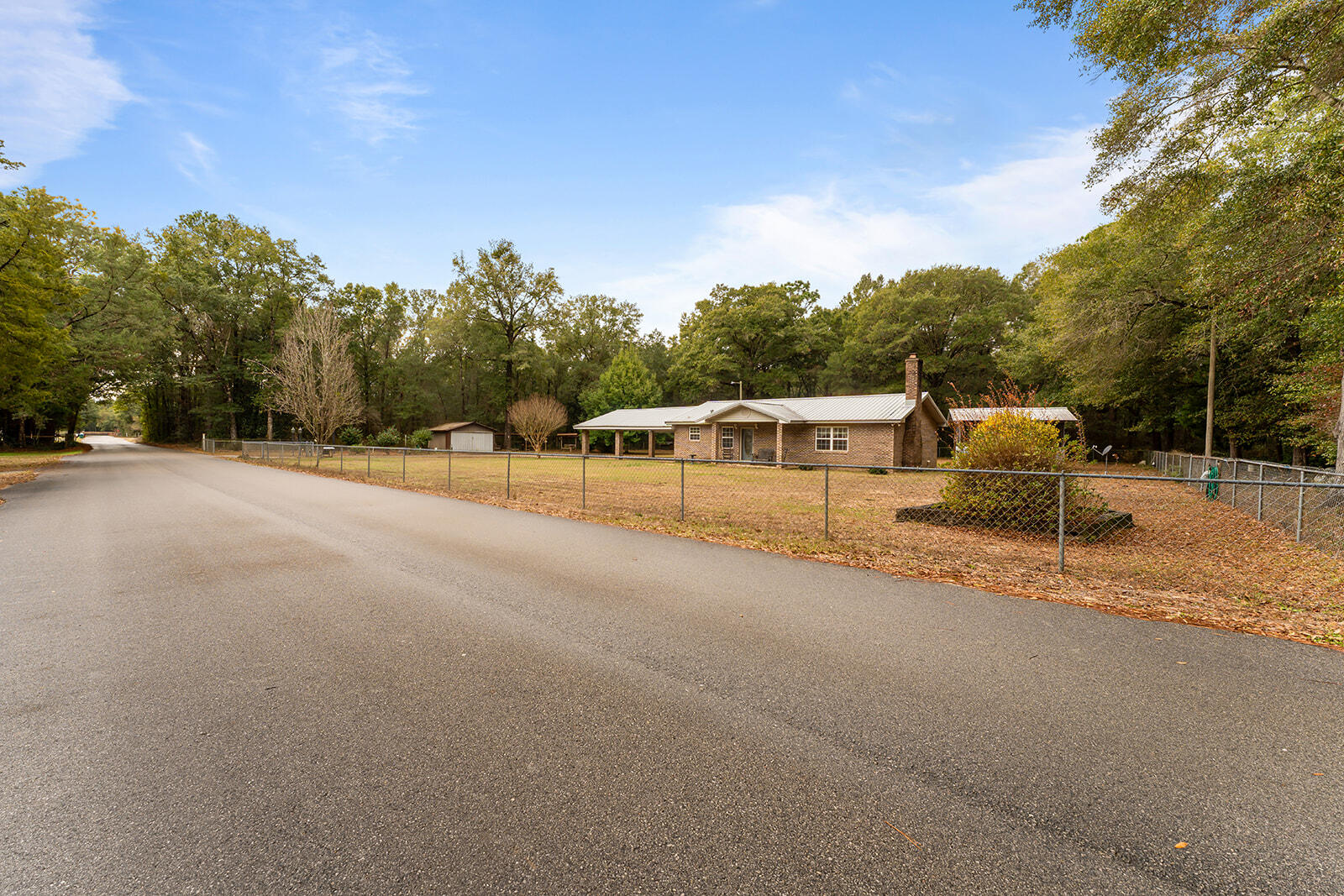 4780 Griffith Road Holt, FL 32564 - Photo 3 of 44 a backyard of a house with table and chairs