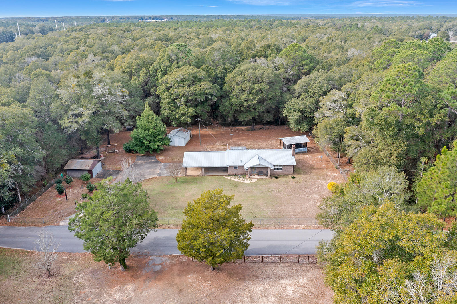 4780 Griffith Road Holt, FL 32564 - Photo 4 of 44 an aerial view of a house with a yard