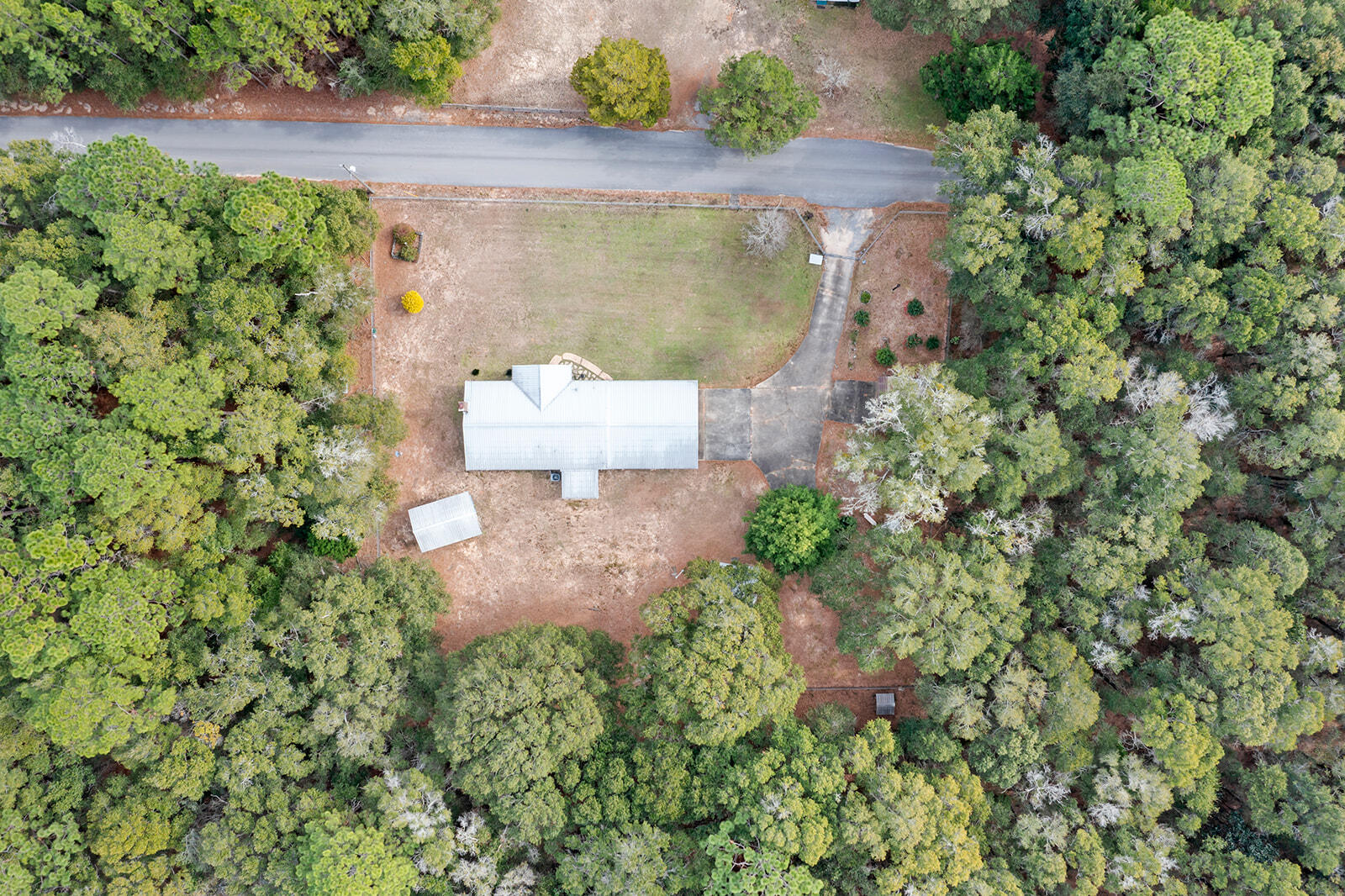 4780 Griffith Road Holt, FL 32564 - Photo 7 of 44 an aerial view of a house with a yard and lake view