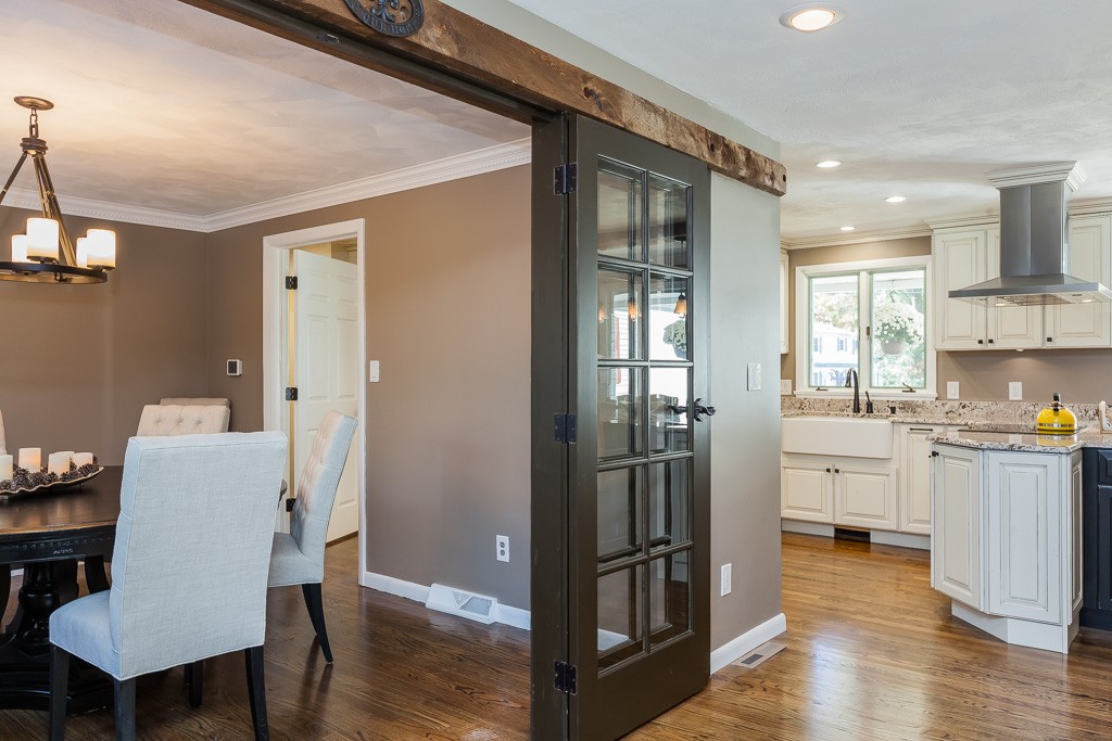 257 Captain Road Longmeadow, MA 01106 - Photo 18 of 30 a open kitchen with white cabinets and stainless steel appliances