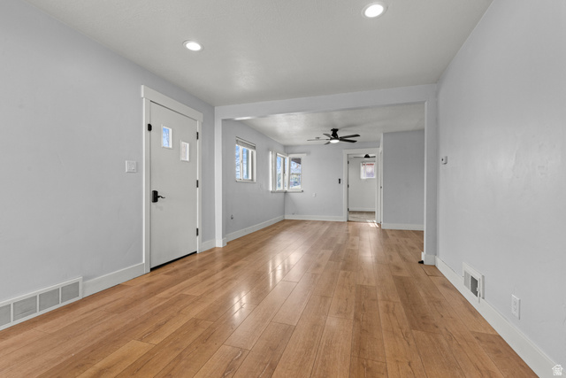 2101 West 3900th Street South Roy, UT 84067 - Photo 9 of 36 Light wood-finish flooring extends throughout this interior space