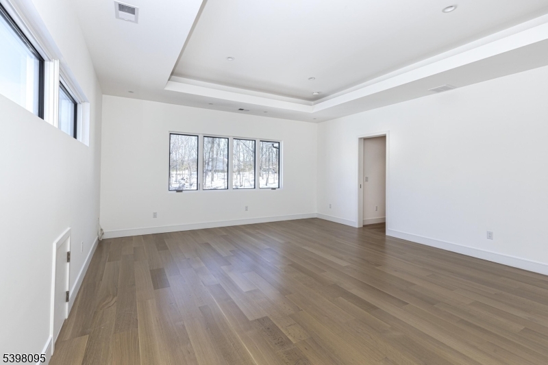 1 Juniper Pointe Trail Dunellen, NJ 08812 - Photo 17 of 44 an empty room with wooden floor and windows