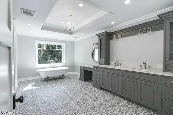 a bathroom with a granite countertop sink toilet and mirror