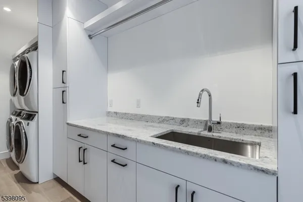 a kitchen with a sink and a refrigerator