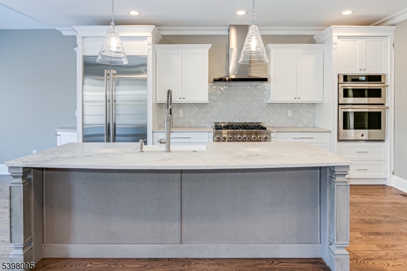 1 Juniper Pointe Trail Dunellen, NJ 08812 - Photo 34 of 44 a kitchen with stainless steel appliances granite countertop a sink and a refrigerator
