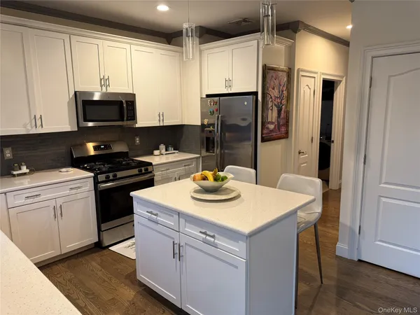 a kitchen with a sink a stove and refrigerator