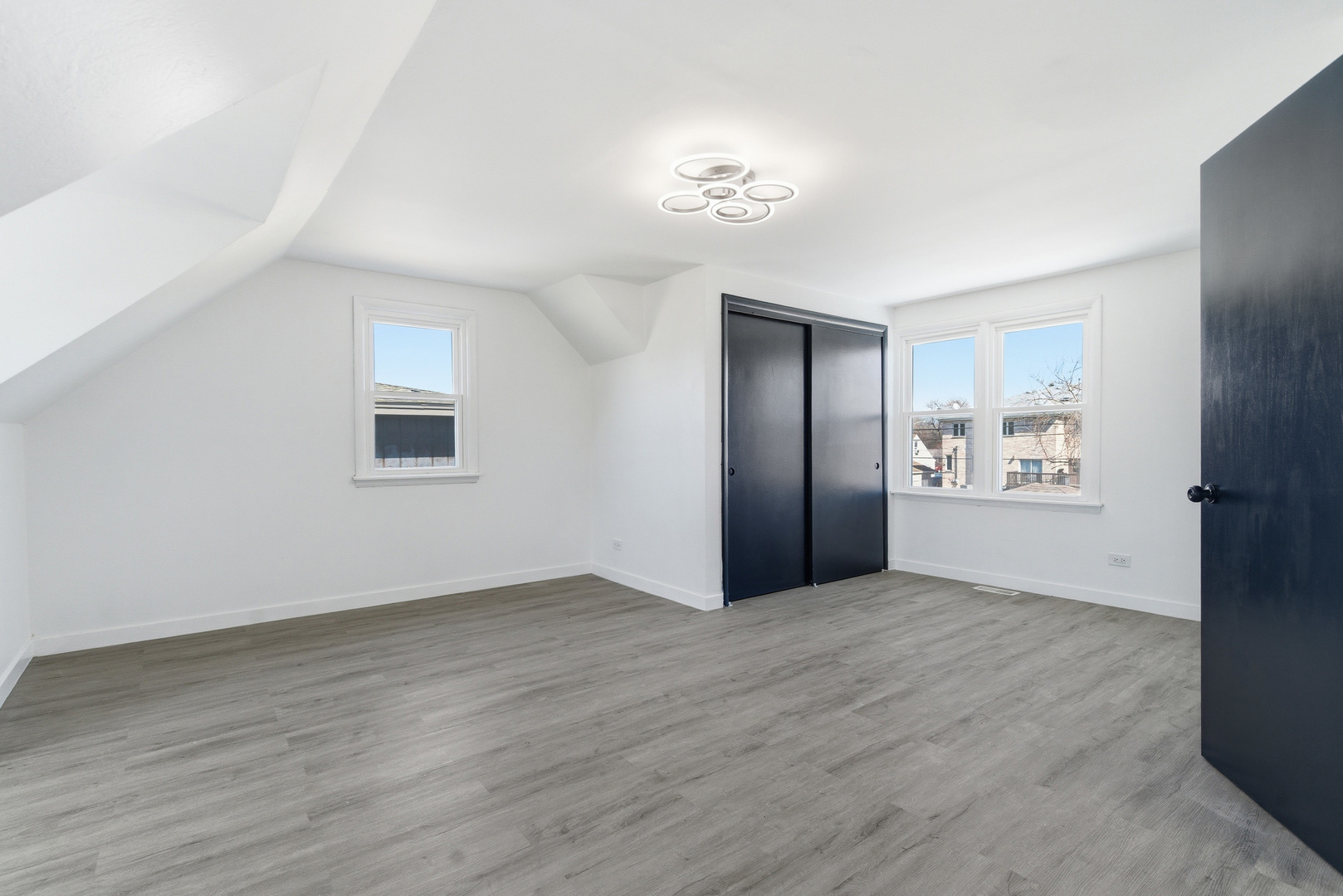 7545 Beloit Avenue Bridgeview, IL 60455 - Photo 12 of 31 a view of an empty room with wooden floor and a window