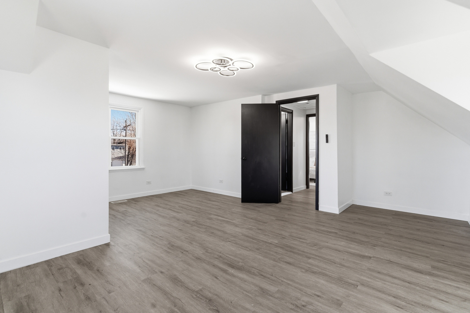 7545 Beloit Avenue Bridgeview, IL 60455 - Photo 13 of 31 an empty room with wooden floor and windows