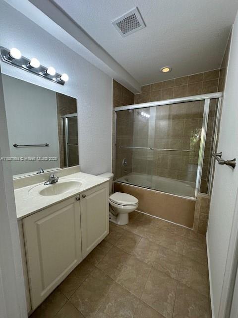 20810 Southwest 87th Avenue, Unit 308 Cutler Bay, FL 33189 - Photo 16 of 24 a bathroom with a double vanity sink toilet and shower