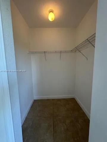 a bathroom with a double vanity sink toilet and shower