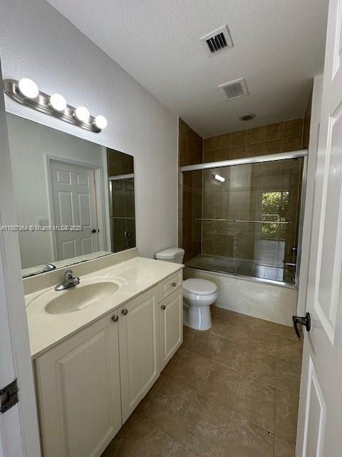 20810 Southwest 87th Avenue, Unit 308 Cutler Bay, FL 33189 - Photo 21 of 24 a bathroom with a double vanity sink toilet and shower