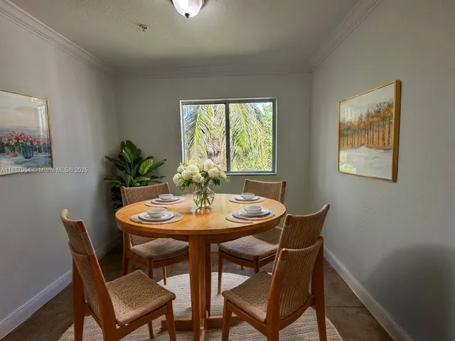 a dining room with furniture and window