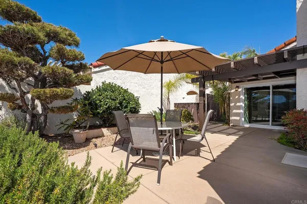 a view of a backyard with sitting area and furniture