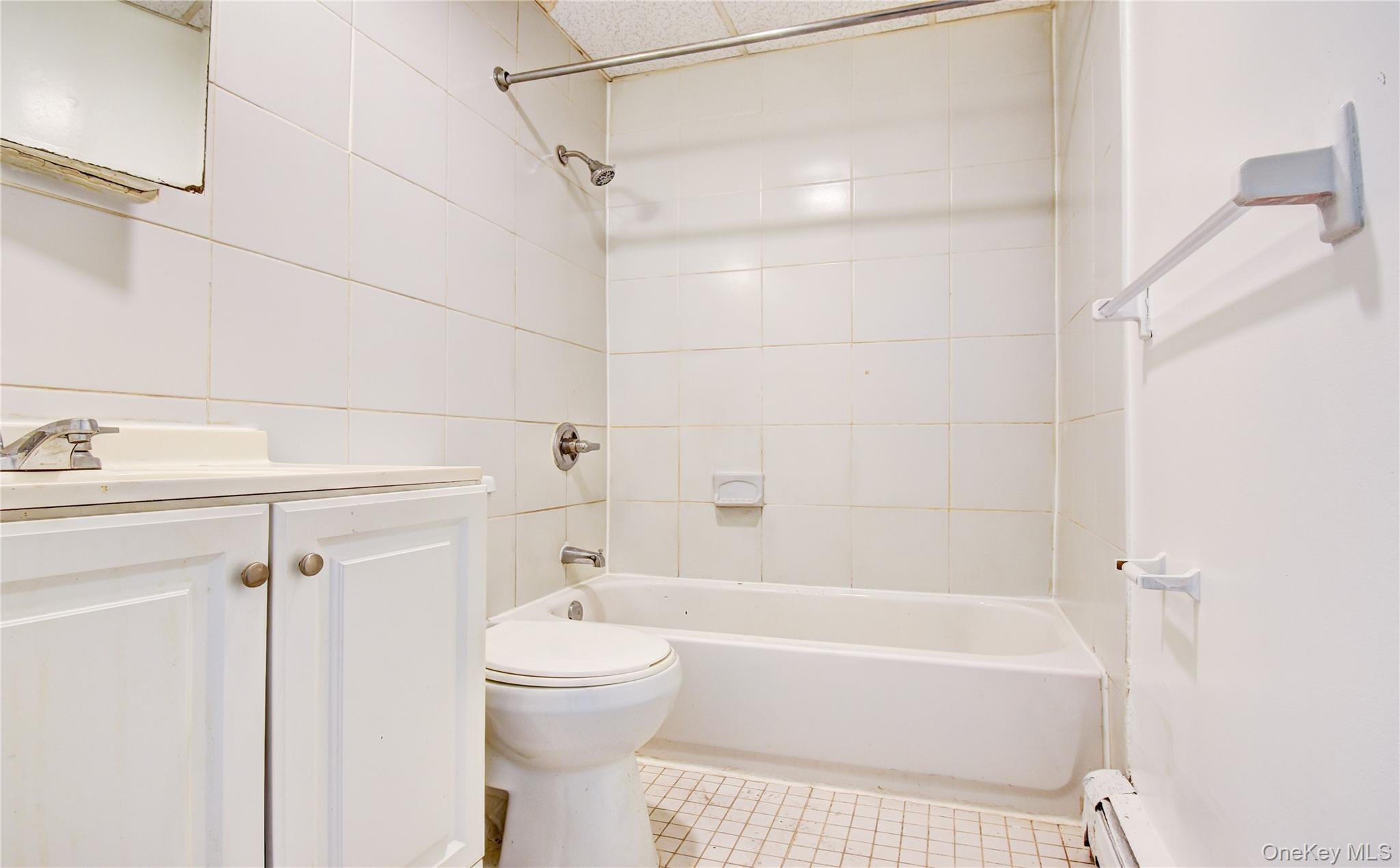 19 Gerald Drive, Unit B2 Poughkeepsie, NY 12601 - Photo 11 of 14 a bathroom with a shower a bathtub and a toilet