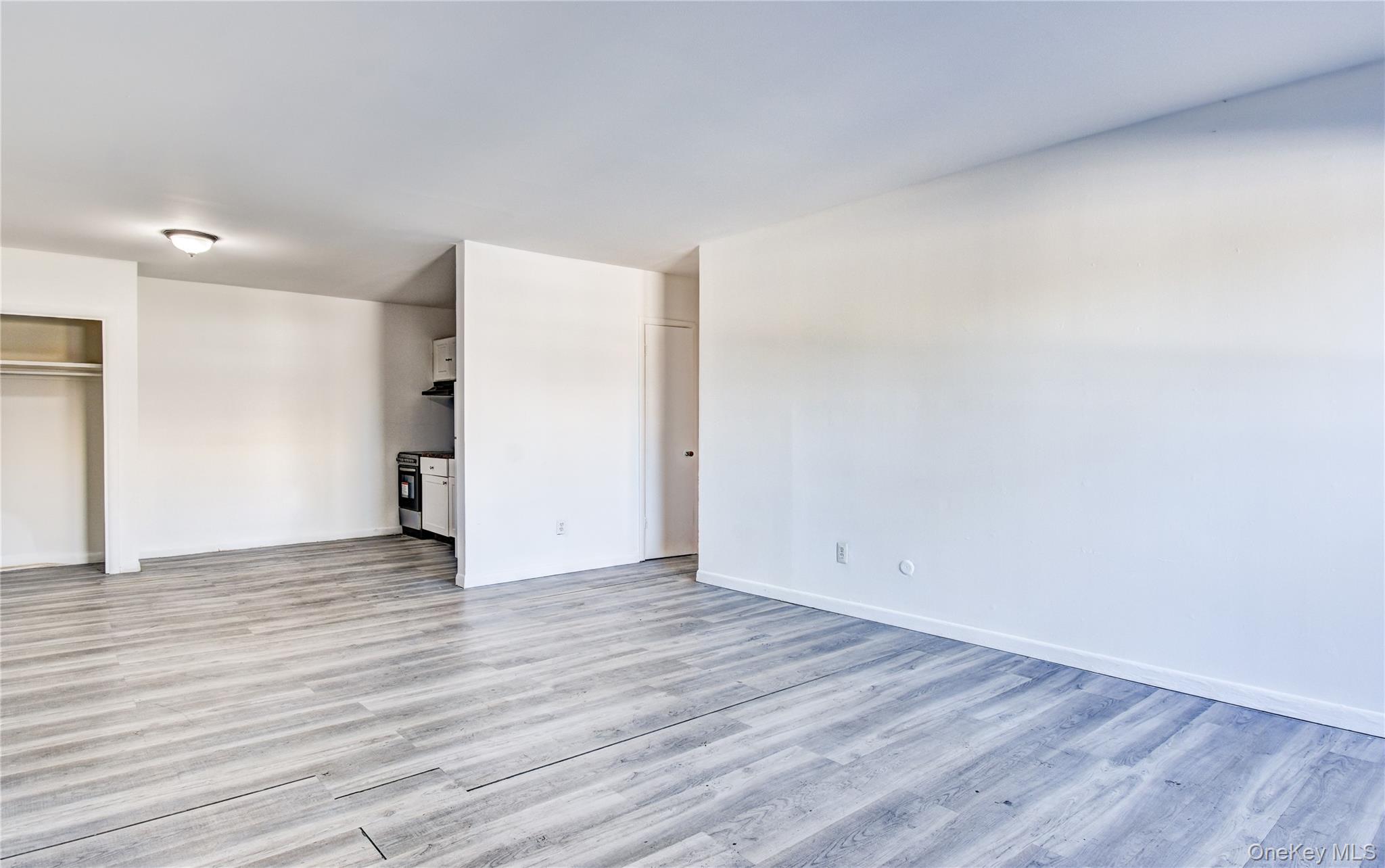 19 Gerald Drive, Unit B2 Poughkeepsie, NY 12601 - Photo 2 of 14 a view of an empty room with wooden floor