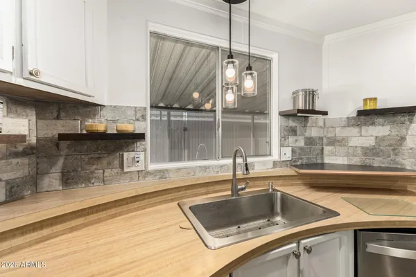 a kitchen with a sink and a refrigerator