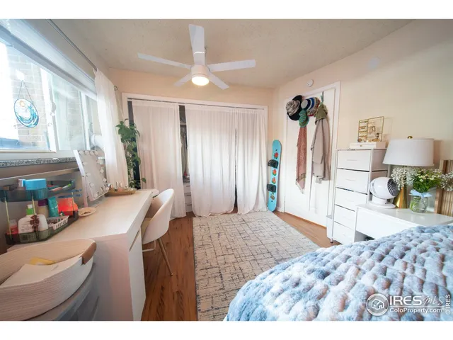 a bedroom with a bed and a dresser in it