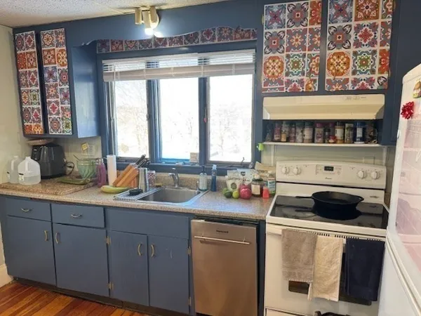 a kitchen with a cabinets and a stove