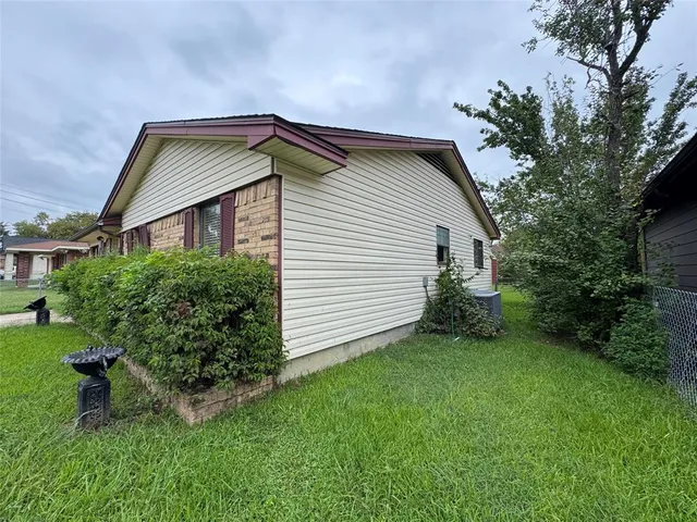 a backyard of a house with lots of green space