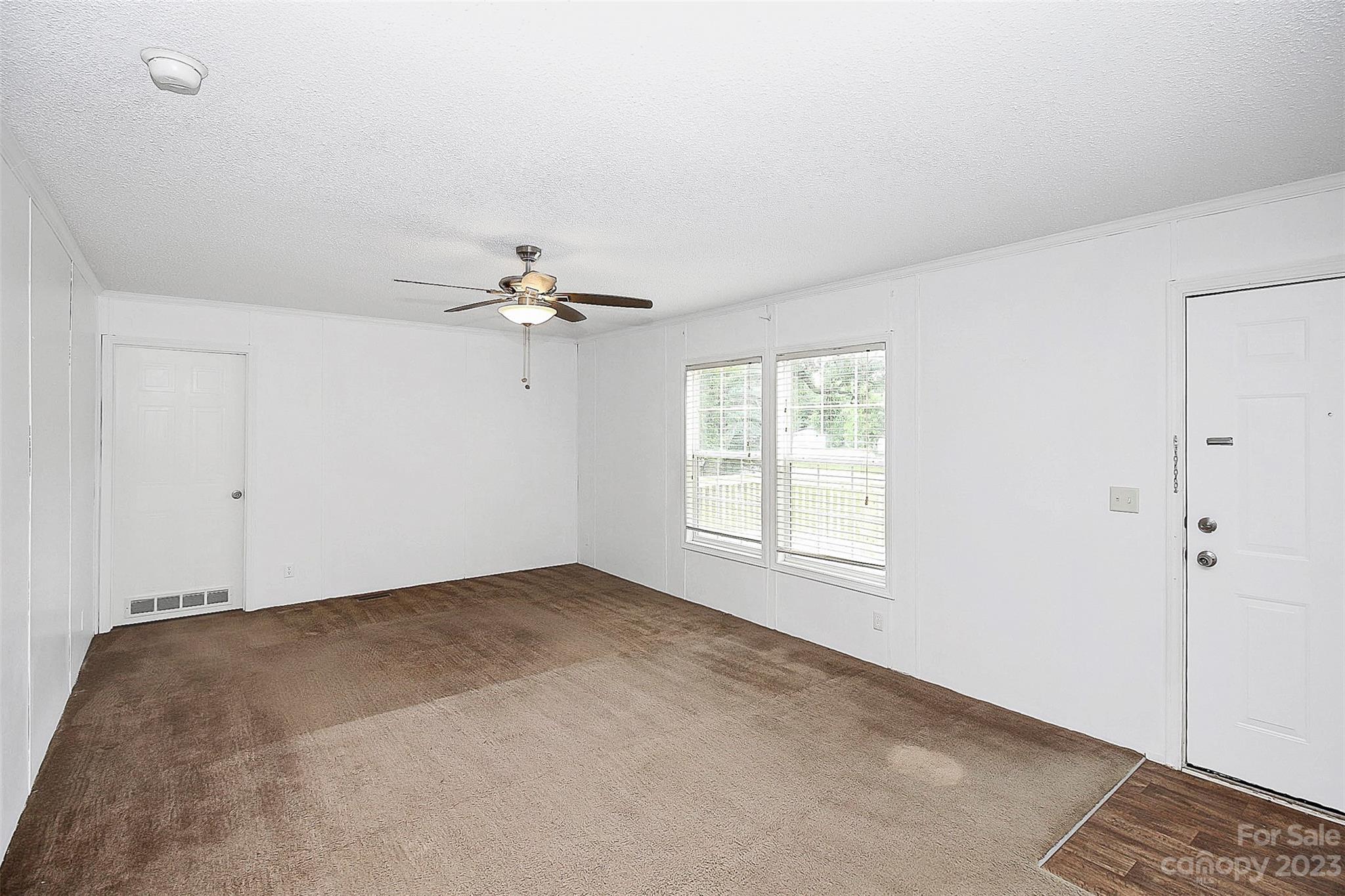 812 Margrace Road Kings Mountain, NC 28086 - Photo 31 of 34 a view of a room with a ceiling fan and a window