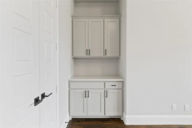 a view of bathroom with granite countertop cabinets