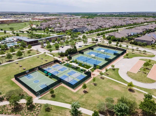 an aerial view of residential houses with outdoor space