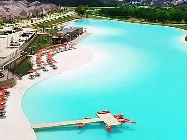 a view of a pool with a yard