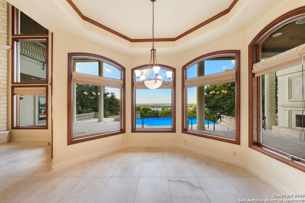 217 Bella Riva Drive Austin, TX 78734 - Photo 12 of 38 a view of an entryway with floor to ceiling windows and door