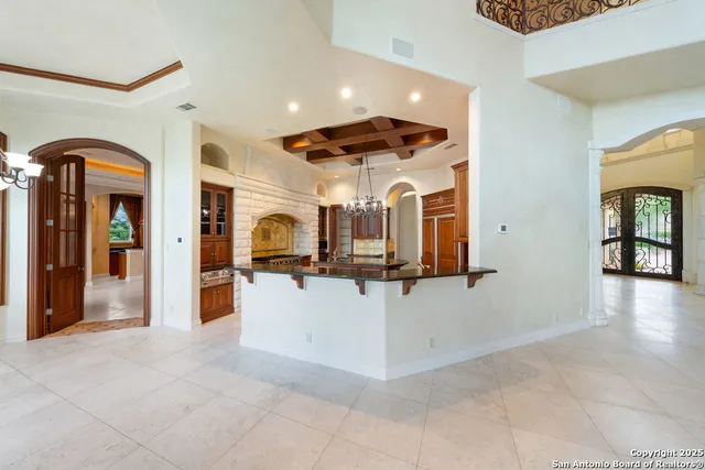 a kitchen with stainless steel appliances granite countertop a stove and a sink