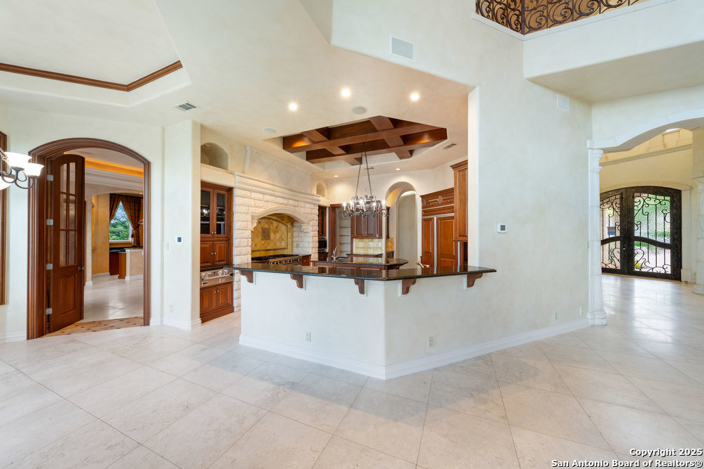 217 Bella Riva Drive Austin, TX 78734 - Photo 14 of 38 a view of a living room with chandelier