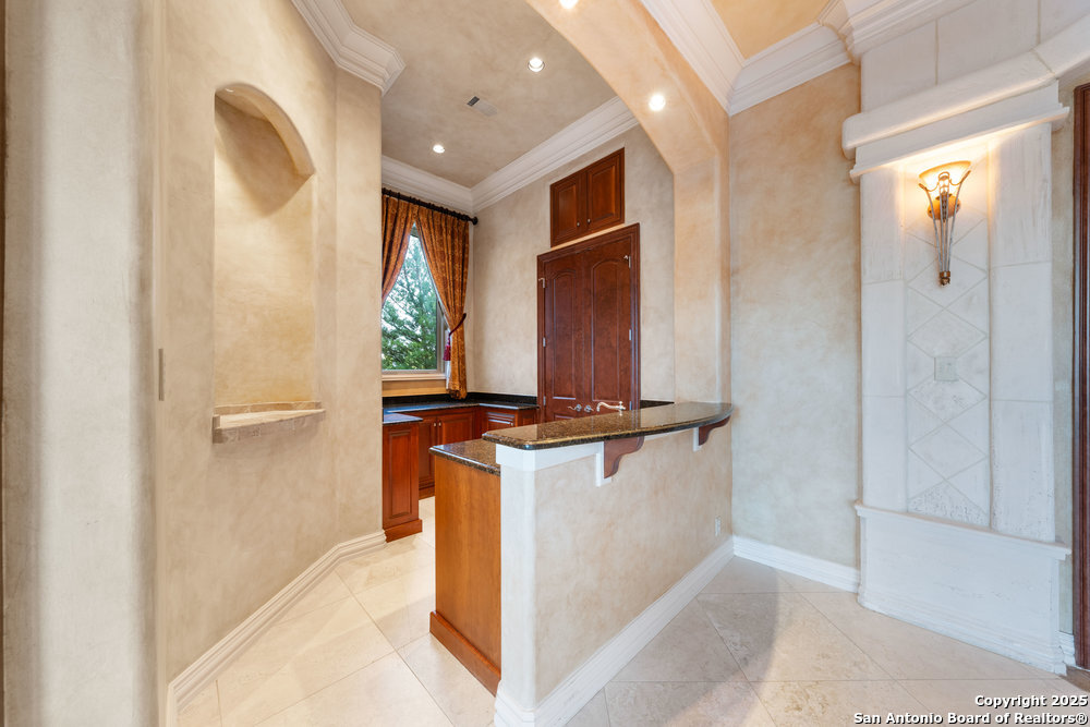 217 Bella Riva Drive Austin, TX 78734 - Photo 18 of 38 a kitchen with stainless steel appliances granite countertop a refrigerator and a stove