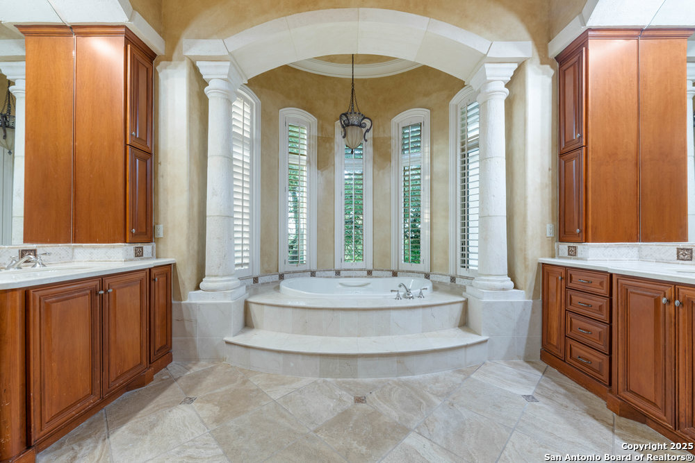 217 Bella Riva Drive Austin, TX 78734 - Photo 21 of 38 a view of living room with a large window and chandelier