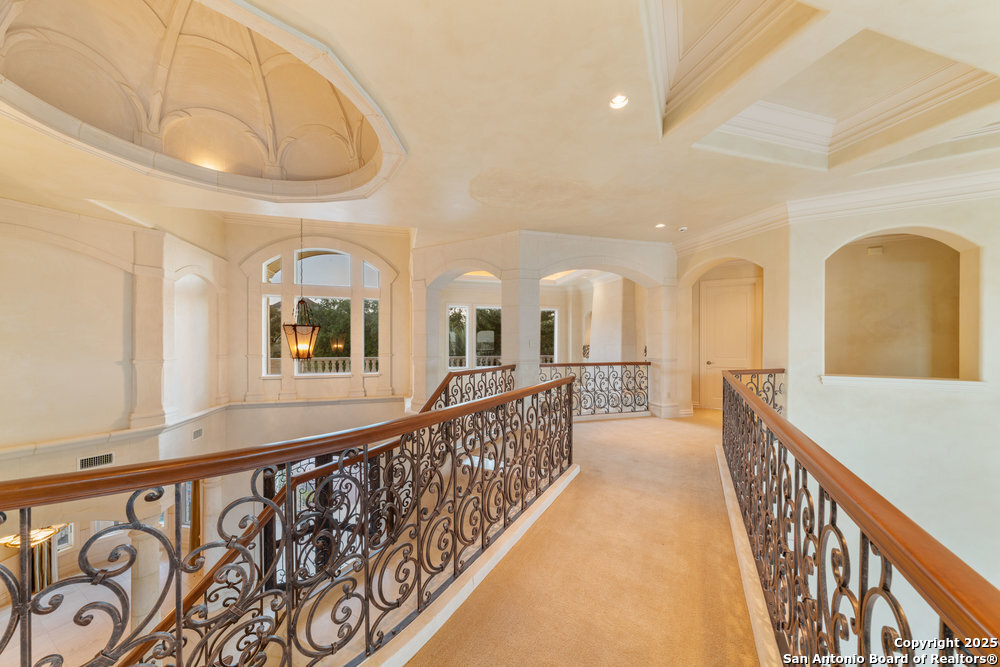 217 Bella Riva Drive Austin, TX 78734 - Photo 27 of 38 a view of a hallway with wooden floor
